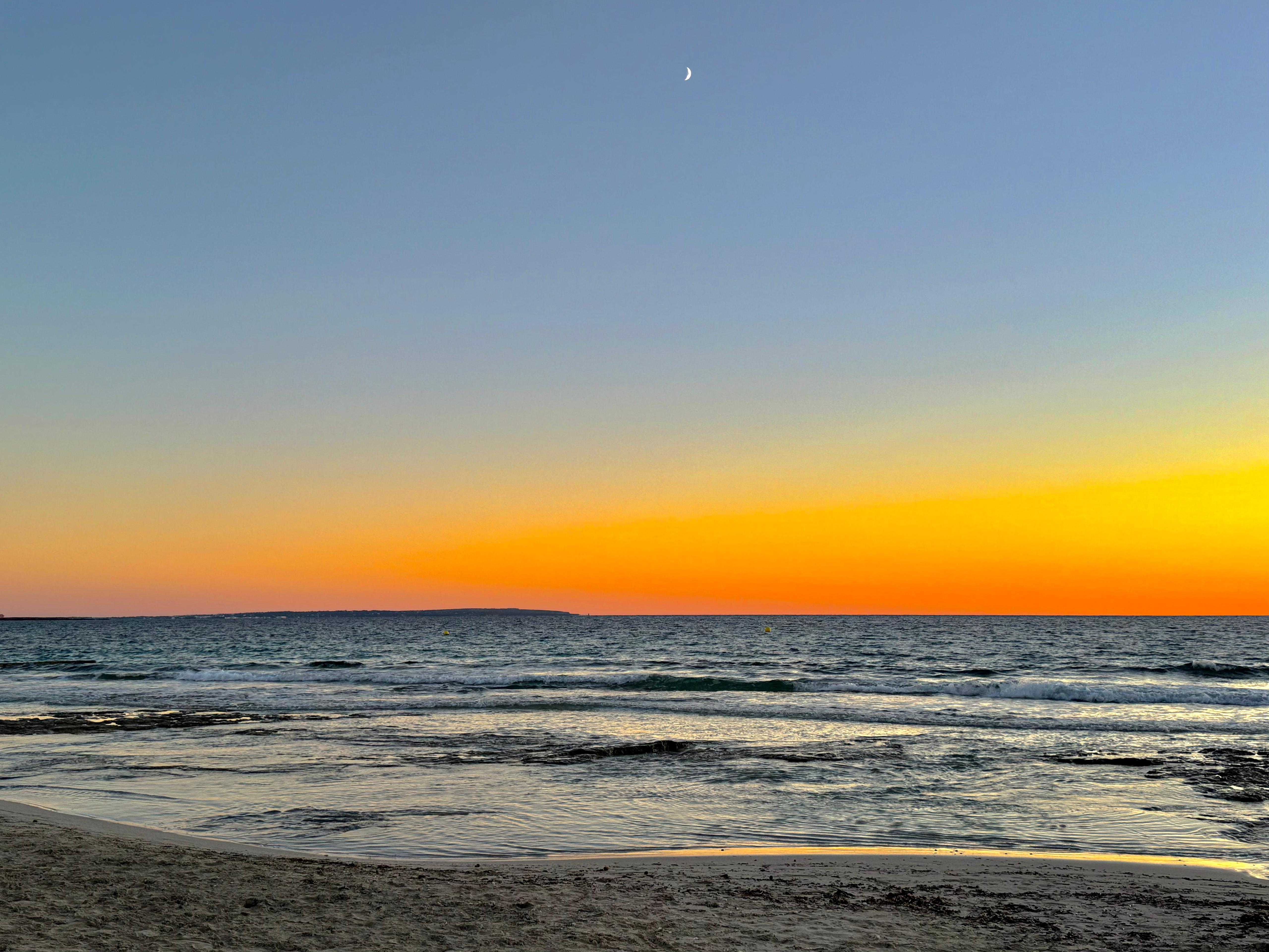 Sea horizon and moon